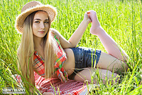 Brunette in the grass