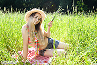 Brunette in the grass
